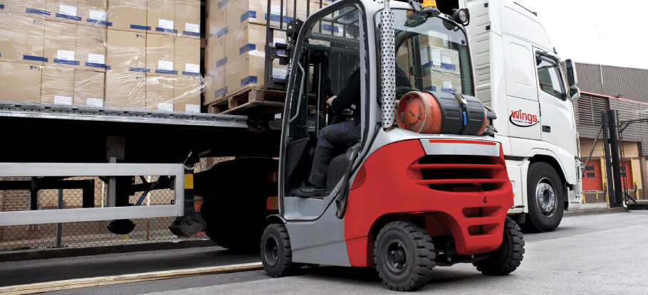 forklift truck loading pallets into Wings Transport lorry